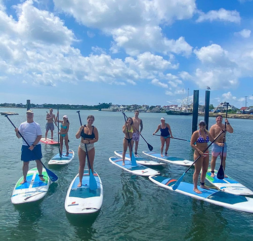 https://eastcoastwatersportsnj.com/images/sup/group-on-boards.jpg